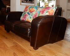 Two identical small buffalo leather sofas