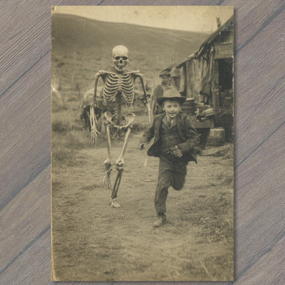 POSTCARD Boy Running Skeleton Halloween Creepy Funny Odd Antique Style Humor