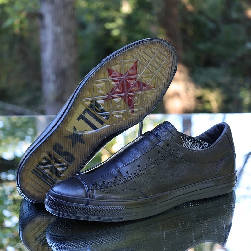 black leather chuck taylors