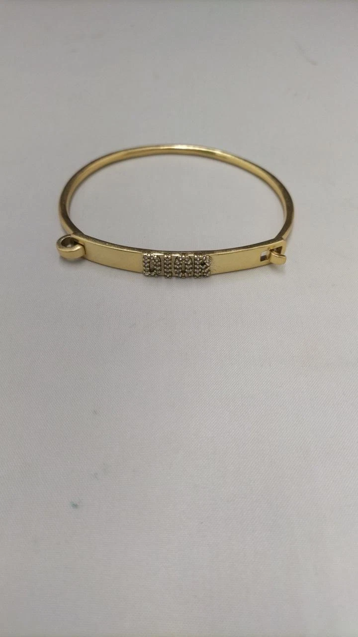 Bracelet CHRISTIAN DIOR doré véritable bijou d'occasion pour femme cadeau élégant
