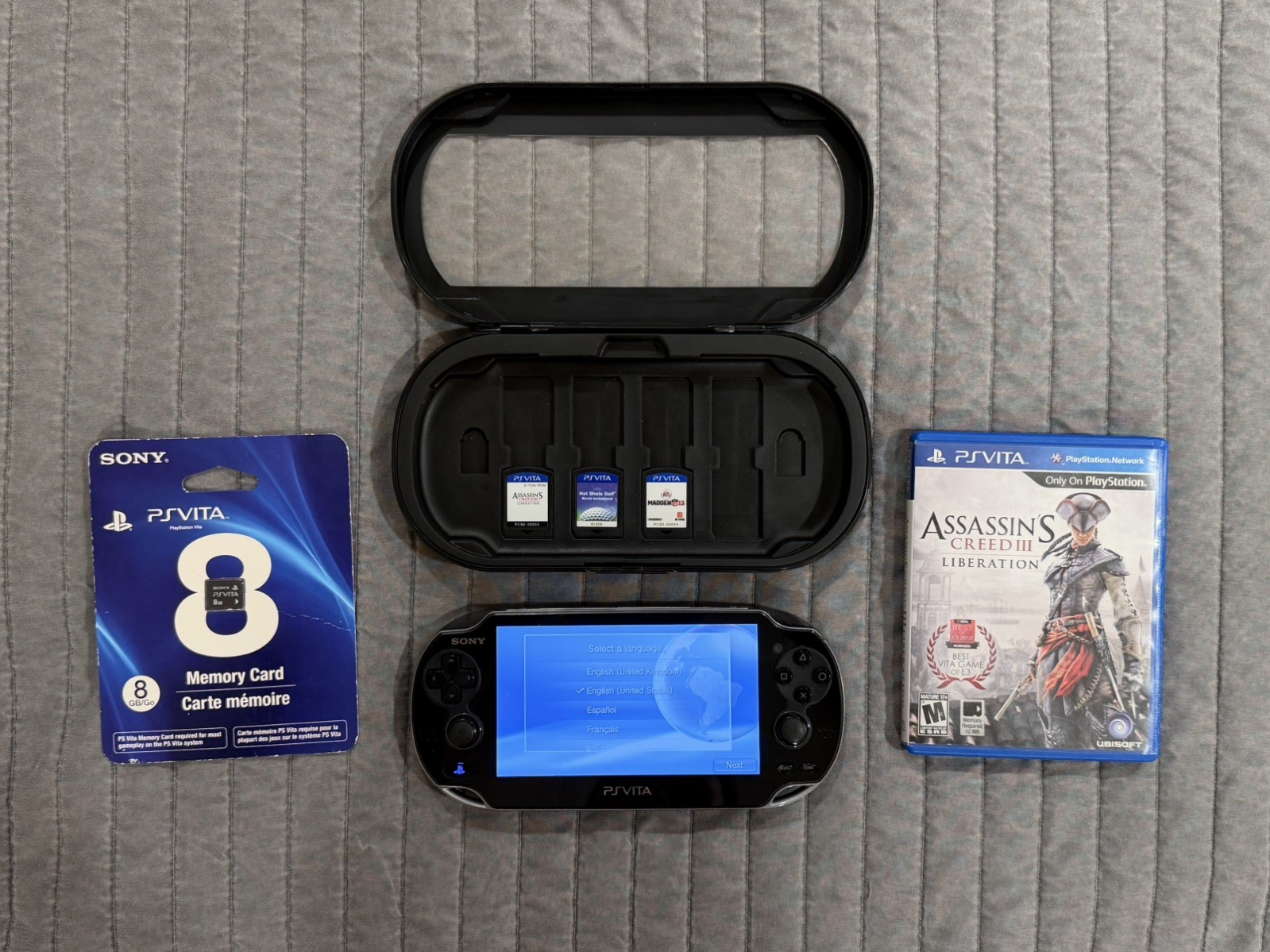 PS Vita 1001 (Black) + 3 Games, 2 Memory Cards, and Hard Case [No Charger]