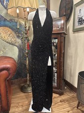 Sequence Black Gown dresses With A V Neck Line And Leg Split.