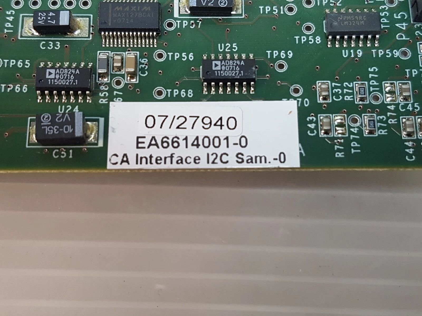 Close-up of the EA6614001-0 label with Maxim MAX127 and Analog Devices AD824A chips