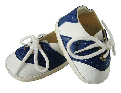 navy blue and white saddle shoes