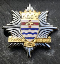 LONDON FIRE BRIGADE CAP BADGE. LCC. (solid Towers) 1948 type