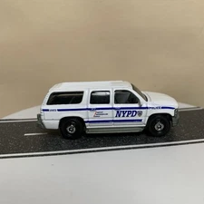 Matchbox Chevrolet Chevy Suburban GMT800 NYPD Police SUV White 1:76 NM