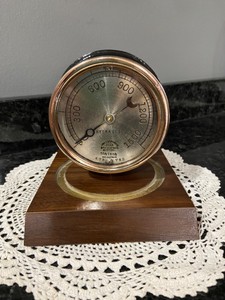 Vintage Brass and cast iron Star hydraulic Gauge desk top display, paper weight.