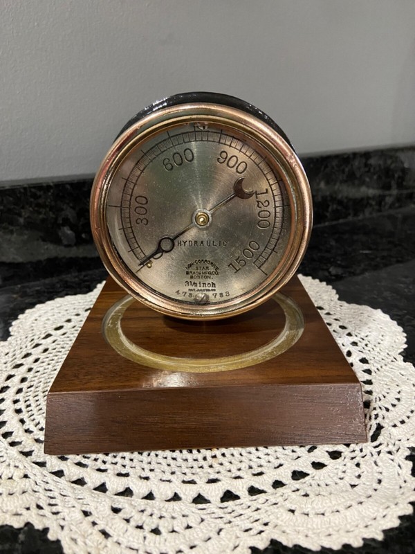 Vintage Brass and cast iron Star hydraulic Gauge desk top display, paper weight.