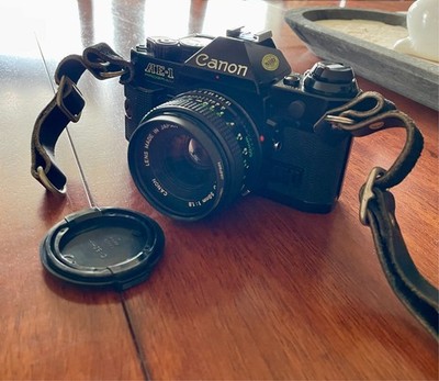 Canon AE-1 SLR Film Camera  with 50mm Canon Lens, exta zoom lens, flash and case