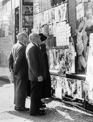 Germany West Berlin people reading small advertisments on a new - 1958 Photo
