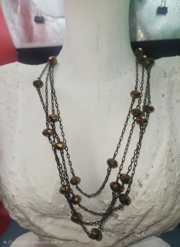 antique-style, layer necklace features dark brass links and faceted brown glass