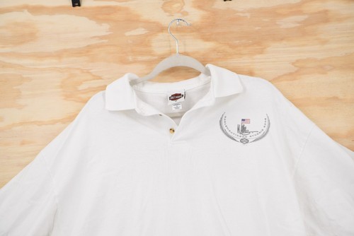White vintage Harley-Davidson Sturgis 2002 polo shirt with black embroidered chest logo and USA flag on left chest.