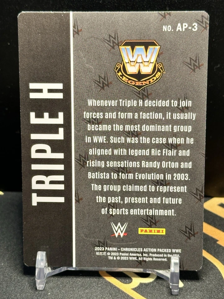 2023 Panini Chronicles WWE - Action Packed Triple H #AP-3 SP Insert - Image 2 of 2