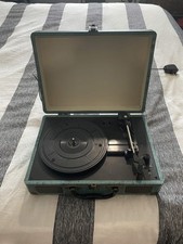 Vintage suitcase record player for vinyls with built in speakers and 3 speeds
