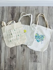 Set of Three Canvas Tote Bags Featuring Unique Graphic Designs. New
