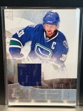2010-11 The Cup Silver Jerseys #7 Henrik Sedin /25