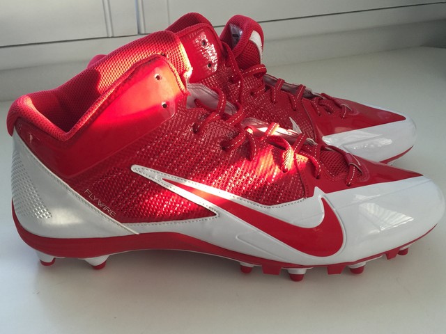 orange and white cleats