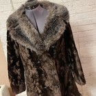 Brown vintage ILGWU winter coat with plush beige fur-lined collar and front button closure on mannequin.