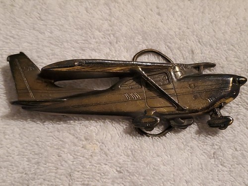 Vintage 1980 Plane J-718 Brass Belt Buckle,  Serial No. 718 New NOS unused - Picture 1 of 7