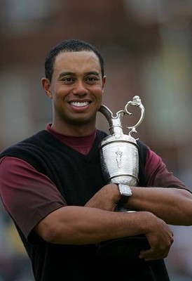 Tiger Woods of the USA hugs the Claret Jug after securing a five s- Old Photo 2