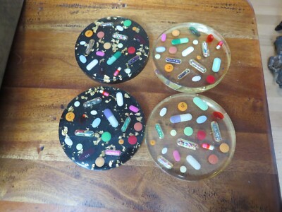 Four 1960's acrylic Pill Drink coasters with gold leaf