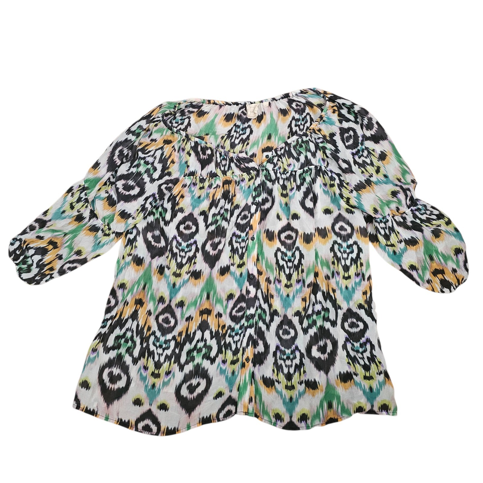 Silk blouse with ikat print pattern.