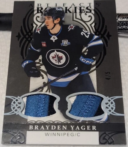 26-27 ARTIFACTS ROOKIE MATERIAL BLACK DUAL PATCH - BRAYDEN YAGER RC /5 #196 JETS