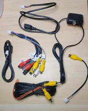 Set of RCA adapter cables and other similar accessories for car radio systems.