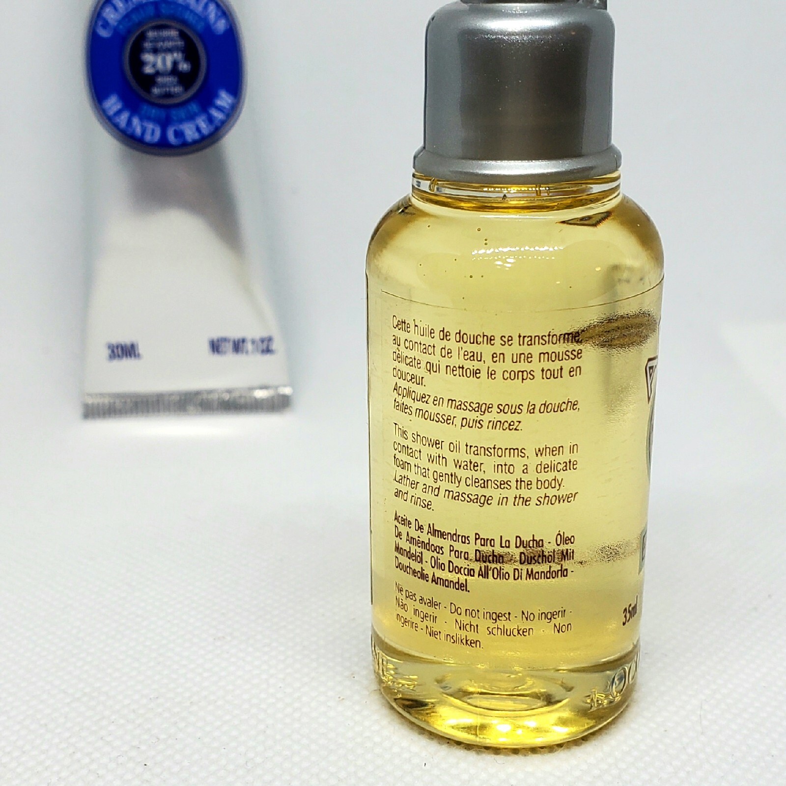 L'Occitane Duo: Shea Butter Hand Cream & Amande Shower Oil. Travel Sz- 1.0 oz ea