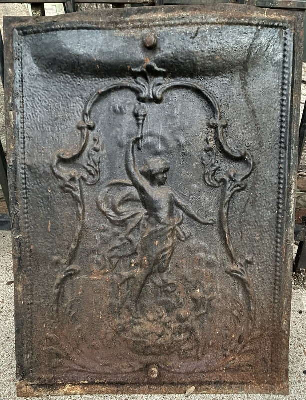 antique stamped tin fireplace cover or fireback “Lady Holding Torch Screen Metal