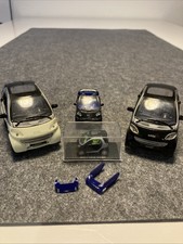 Konvolut 4 Smart ForTwo Modelle in 1:87, 1:33, 1:64. Von Maisto, Siku, Busch