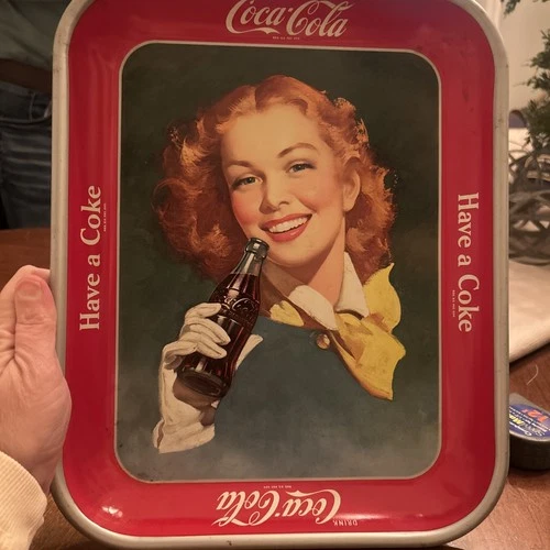 This is a vintage 1940s-1950s Coca-Cola metal serving tray