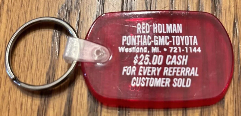 Vintage Pontiac dealership advertising keychain Westland Michigan