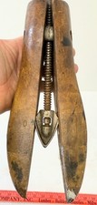 Antique antique wooden shoe stretcher with a metal rod and handle