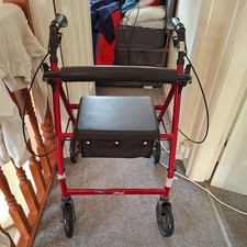 drive Walker 4 Wheel With Seat And Basket and brakes.