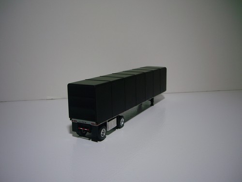 DCP FIRST GEAR 1/64 TEAL PETE 579 WITH SLEEPER AND SIMULATED ROLL TARP TRAILER - Picture 8 of 12