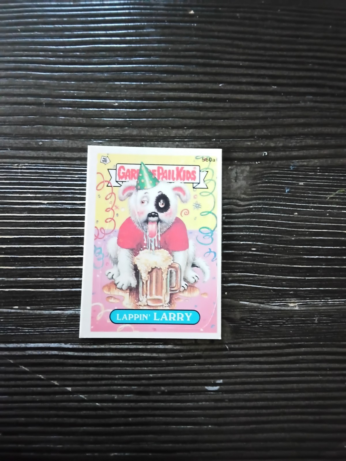 Lappin' LARRY #560a 1988 Garbage Pail Kids trading card — raw and PSA graded price guide