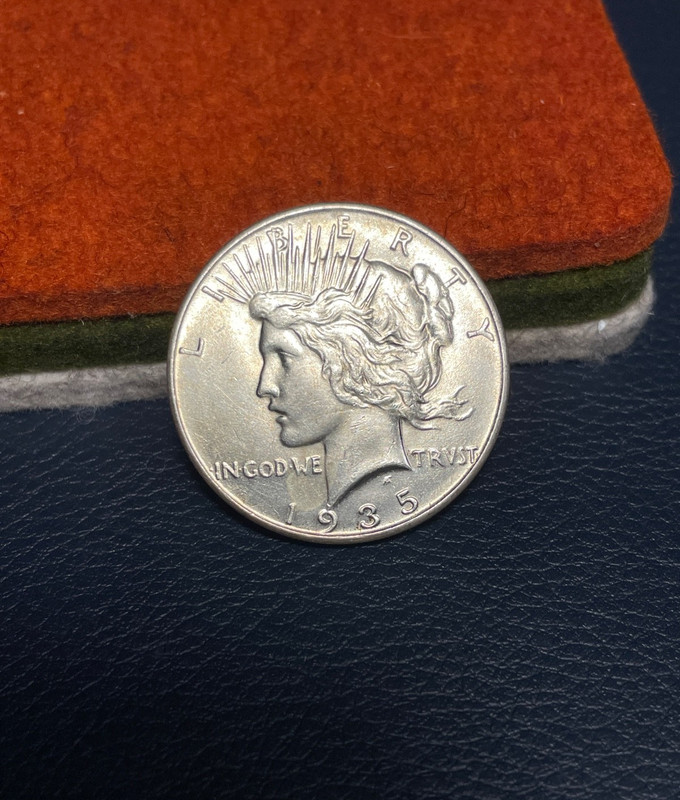 (#102100) Peace Dollar:  1935    unc   better date   (see video!)