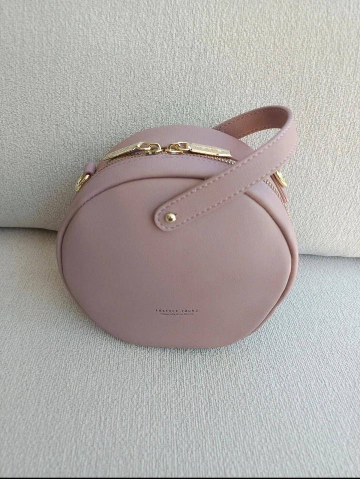 Sac bandoulière femme rond rose similicuir uni fermeture éclair doré - Photo 4/4
