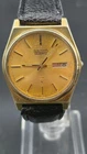 Vintage Seiko Quartz Gold-Tone Day Date Champagne Waffle Dial Watch