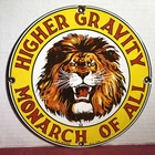 VINTAGE 1934 DATED HIGHER GRAVITY MONARCH OF ALL LION 10” PORCELAIN GAS OIL SIGN