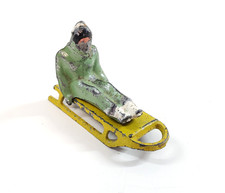 Barclay Christmas Winter Village Lead Green Figure Rider Sledding Sled Vintage