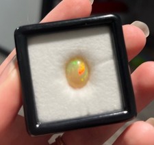 3.01-3.50 Ct 10x8mm Ethiopian Opal Loose Gemstone In Case With Detail On Back