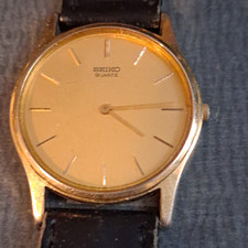 Older Seiko Quartz Gold-Tone Dial Dress Watch Black Leather Strap Analog
