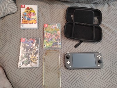 Nintendo Switch Lite (Black) + 3 games and accessories lot