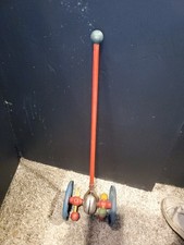 VINTAGE METAL TIN CHILD'S PUSH TOY, WHEELS, NOISEMAKER