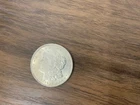 1921 Silver Dollar with an Old Crow Whiskey Plastic Coin Case.