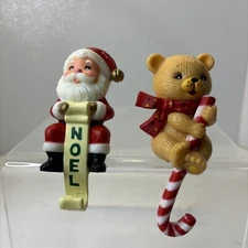 VTG Christmas Stocking Hanger Holder Santa Claus Noel Teddy Candy Cane Lot Of 2