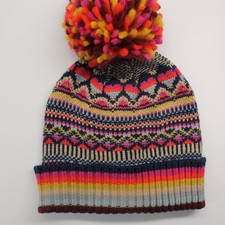Big colorful pom-pom knit winter hat heart pattern