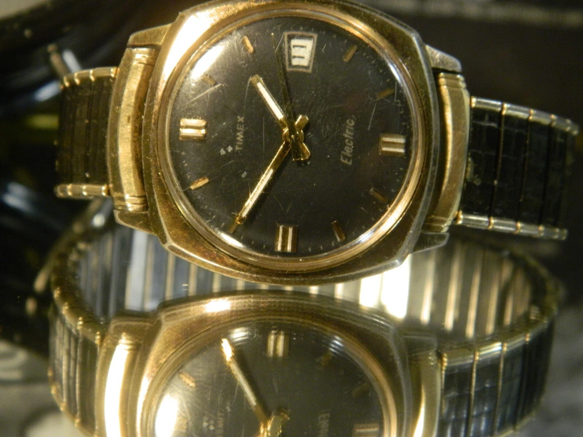 Excellent Timex Black Dial Electric Powered Mechanical Gold Date